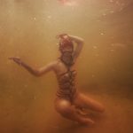Model Marina in ropes under the water | Salty ropes