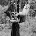 Suspended sexy model in ropes